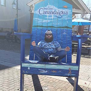 A picture of Paul Wise meditating 
                    in a huge, oversized beach chair